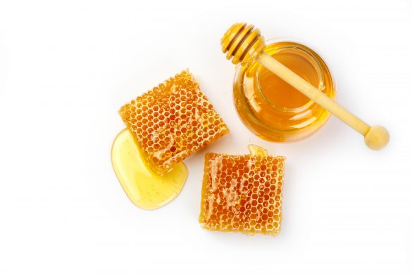 Bee,Products,With,Honey,And,Sweet,Honeycomb,Isolated,On,White